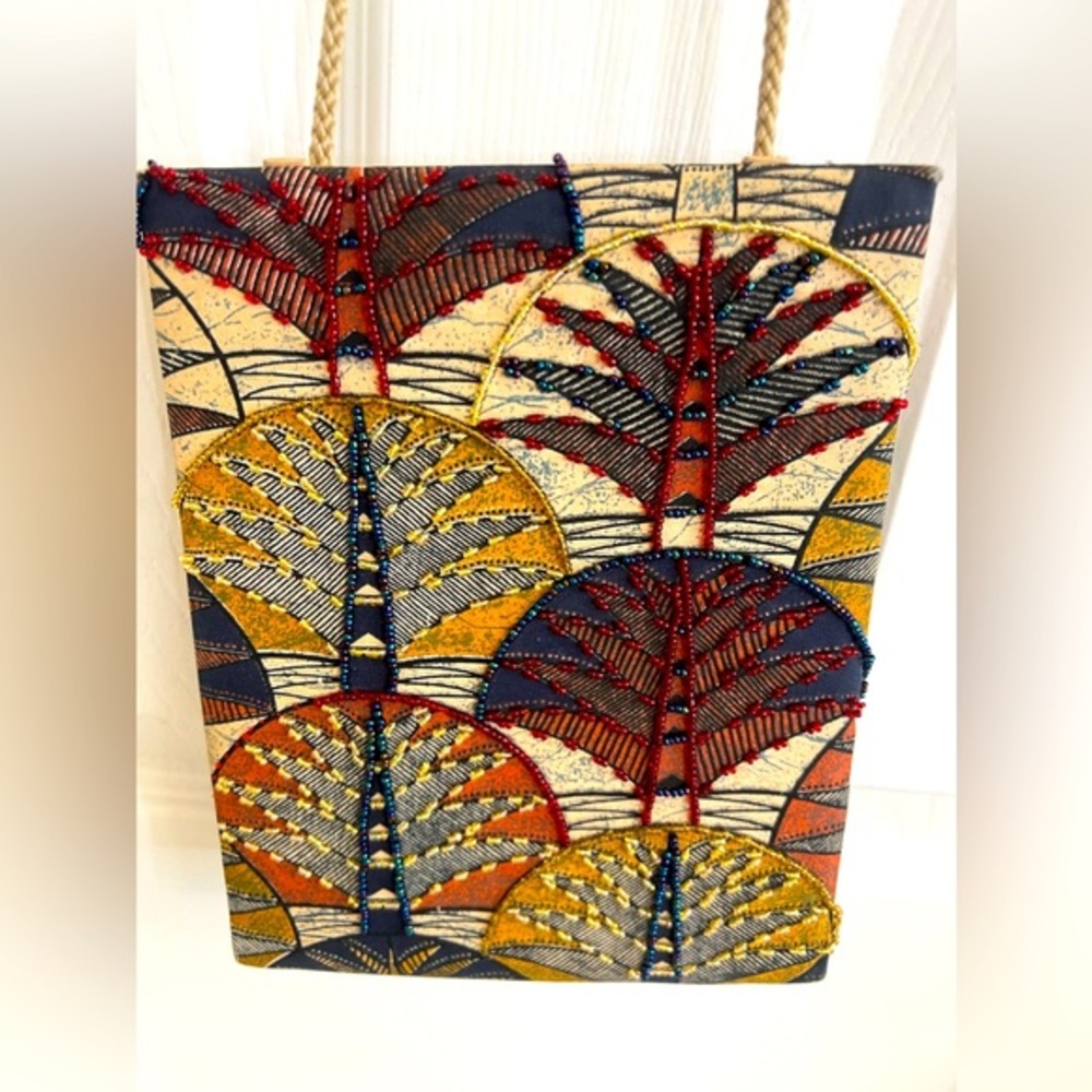 Prezzo crossbody. Light beading on front.